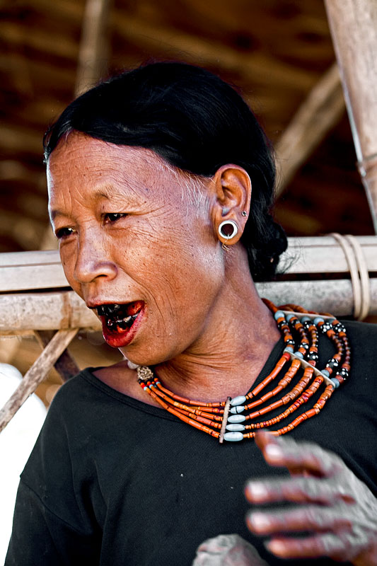  A Konyak woman with black lacquered teeth at Shangnyu Village near Mon